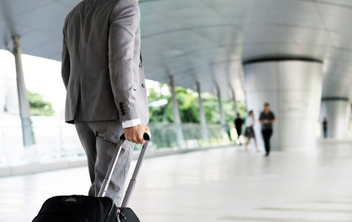 businessman holding luggage business trip 53876 26289  Mitra IT | Your Trusted & Reliable Software Solutions
