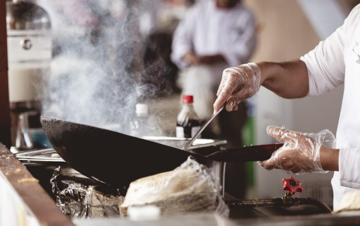 Closeup shot of a chef cooking with a blurred background  Mitra IT | Your Trusted & Reliable Software Solutions
