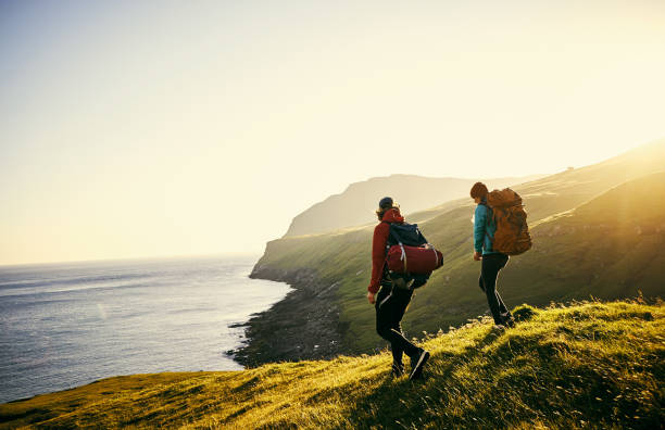 Shot of a young couple hiking through the mountains  Mitra IT | Your Trusted & Reliable Software Solutions