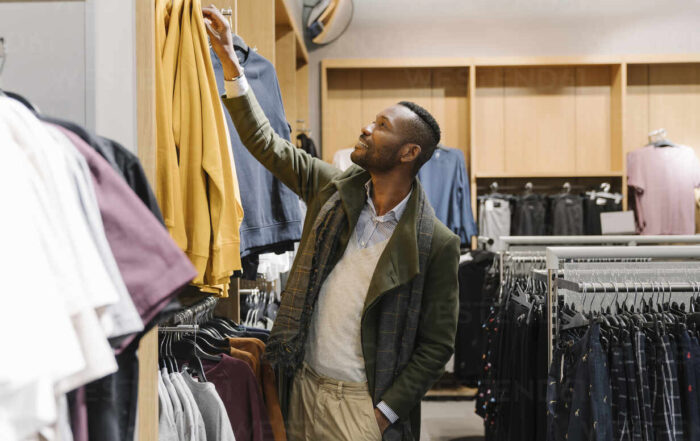 Stylish man shopping in a clothes store The Future of Retail and Wholesale Technology Mitra IT | Your Trusted & Reliable Software Solutions tecnology,  retail,  wholesale