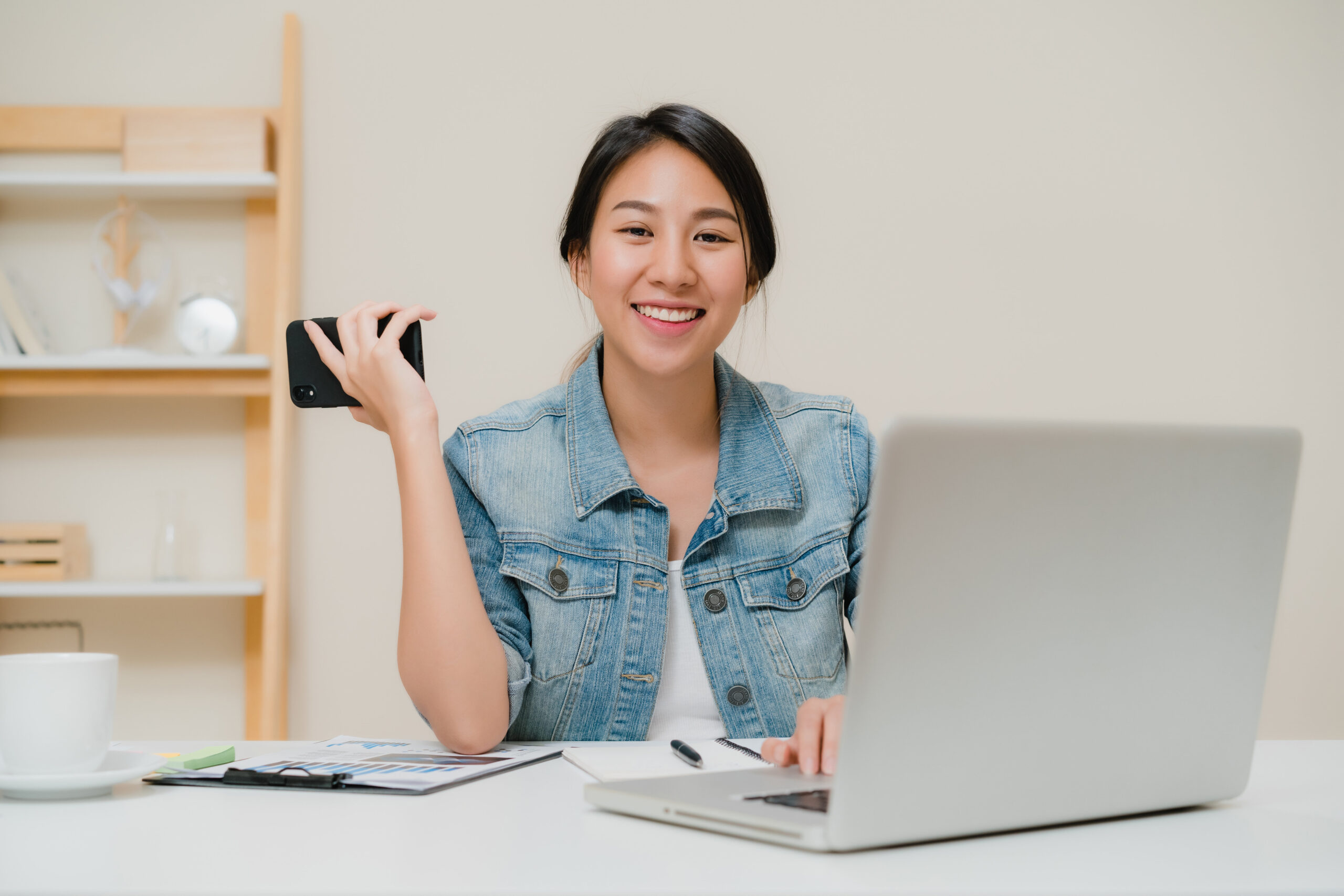 Beautiful smart business Asian woman in smart casual wear workin Mitra IT | Your Trusted & Reliable Software Solutions